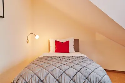 Ein Bett oder Betten in einem Zimmer der Unterkunft Hotel Parc Fermé am Nürburgring