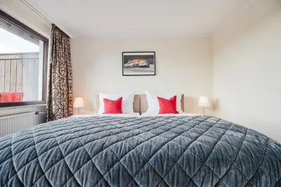 Ein Bett oder Betten in einem Zimmer der Unterkunft Hotel Parc Fermé am Nürburgring