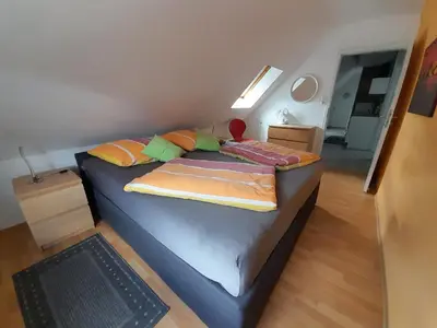 Ein Bett oder Betten in einem Zimmer der Unterkunft FeWo Karola