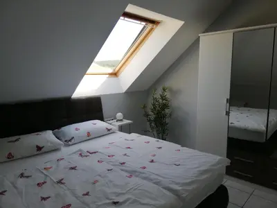 Ein Bett oder Betten in einem Zimmer der Unterkunft Ferienwohnung Panoramablick