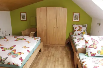 Ein Bett oder Betten in einem Zimmer der Unterkunft Ferienwohnung Erika