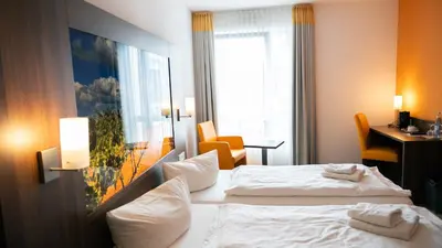 Ein Bett oder Betten in einem Zimmer der Unterkunft Alembra - Wein Style Hotel