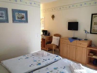 Ein Bett oder Betten in einem Zimmer der Unterkunft The Place After the Race B&B
