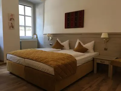 Ein Bett oder Betten in einem Zimmer der Unterkunft Rheinhotel St. Goar