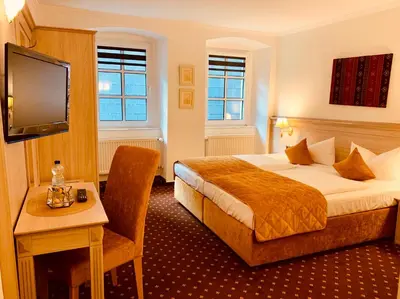 Ein Bett oder Betten in einem Zimmer der Unterkunft Rheinhotel St. Goar