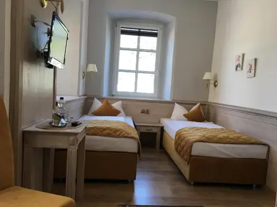 Ein Bett oder Betten in einem Zimmer der Unterkunft Rheinhotel St. Goar