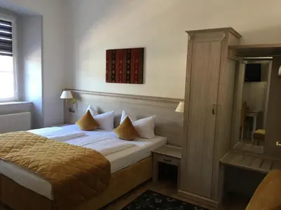 Ein Bett oder Betten in einem Zimmer der Unterkunft Rheinhotel St. Goar