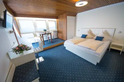 Ein Bett oder Betten in einem Zimmer der Unterkunft Gästehaus-Weingut Loersch
