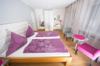 Ein Bett oder Betten in einem Zimmer der Unterkunft Gästehaus-Weingut Loersch