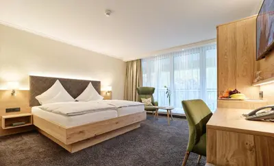 Ein Bett oder Betten in einem Zimmer der Unterkunft Hotel Weis