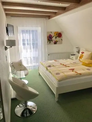Ein Bett oder Betten in einem Zimmer der Unterkunft Haus Marientaler Au GbR