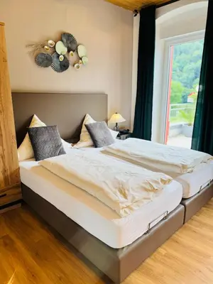 Ein Bett oder Betten in einem Zimmer der Unterkunft Mosel-Landhaus Hotel Oster