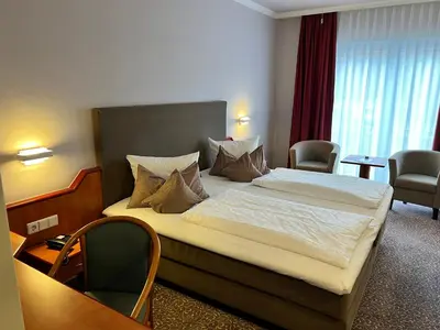 Ein Bett oder Betten in einem Zimmer der Unterkunft Hotel Victoria
