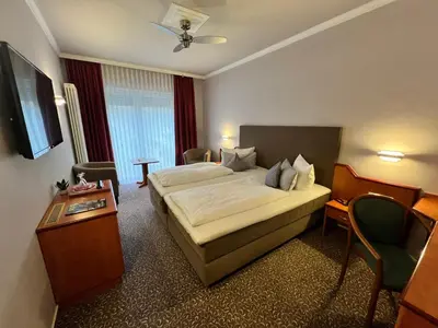 Ein Bett oder Betten in einem Zimmer der Unterkunft Hotel Victoria