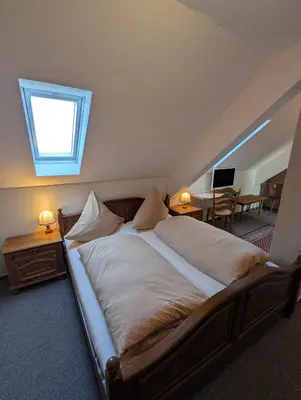 Ein Bett oder Betten in einem Zimmer der Unterkunft Zenners Landhotel