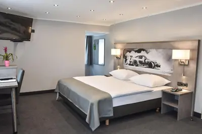 Ein Bett oder Betten in einem Zimmer der Unterkunft GT3 Hotel