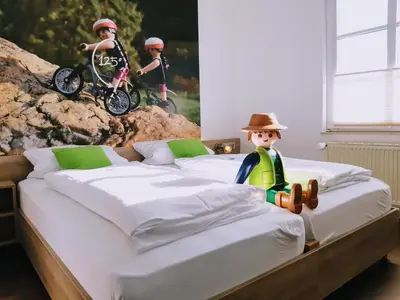 Ein Bett oder Betten in einem Zimmer der Unterkunft Winkelwerkstatt Hotel