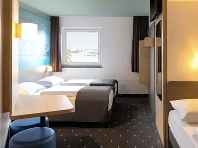 Ein Bett oder Betten in einem Zimmer der Unterkunft B&B Hotel Koblenz-City
