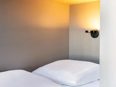 Ein Bett oder Betten in einem Zimmer der Unterkunft B&B Hotel Koblenz-City