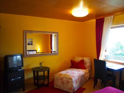 Ein Bett oder Betten in einem Zimmer der Unterkunft Berghotel Wintersberg