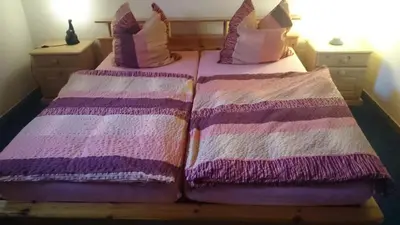 Ein Bett oder Betten in einem Zimmer der Unterkunft Ferienwohnung An der Loreley