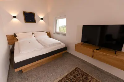 Ein Bett oder Betten in einem Zimmer der Unterkunft Tullius Die Rebmeisterei