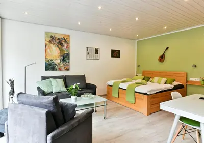 Ein Bett oder Betten in einem Zimmer der Unterkunft Appartements Moselblick