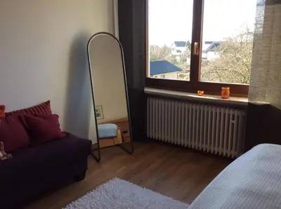 Ein Bett oder Betten in einem Zimmer der Unterkunft Haus Hunsrückhöhe