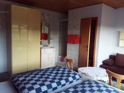 Ein Bett oder Betten in einem Zimmer der Unterkunft Pension Mühlenhardt
