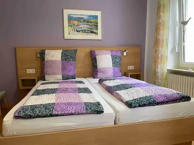 Ein Bett oder Betten in einem Zimmer der Unterkunft Pension Bartz