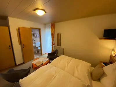 Ein Bett oder Betten in einem Zimmer der Unterkunft Pension Milberg Assmannshausen
