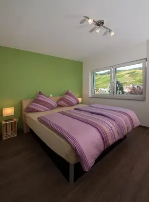 Ein Bett oder Betten in einem Zimmer der Unterkunft Gästehaus Vinaria