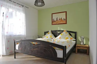 Ein Bett oder Betten in einem Zimmer der Unterkunft Gästehaus Vinaria