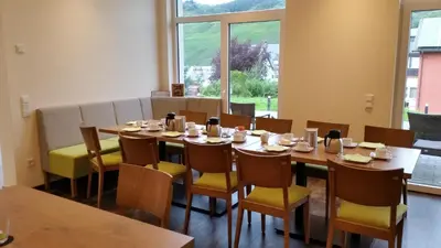 Ein Restaurant oder anderes Speiselokal in der Unterkunft Gästehaus Vinaria