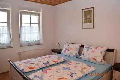 Ein Bett oder Betten in einem Zimmer der Unterkunft Ferienweingut Borens