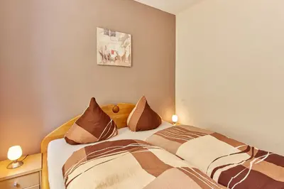 Ein Bett oder Betten in einem Zimmer der Unterkunft Cafe Rosi Ferienwohnung