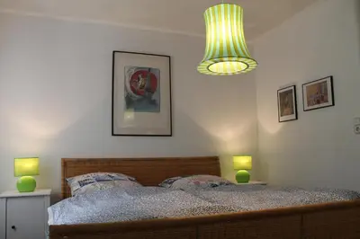 Ein Bett oder Betten in einem Zimmer der Unterkunft Maison Mille Fleurs