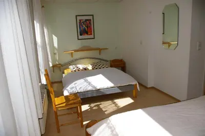Ein Bett oder Betten in einem Zimmer der Unterkunft Ferienhaus Waldrand