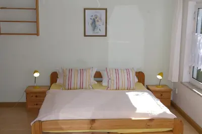 Ein Bett oder Betten in einem Zimmer der Unterkunft Ferienhaus Waldrand