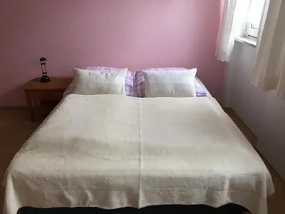Ein Bett oder Betten in einem Zimmer der Unterkunft Ferienhaus Waldrand