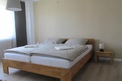 Ein Bett oder Betten in einem Zimmer der Unterkunft Gästehaus Fichtenwäldche
