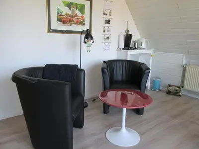 Ein Sitzbereich in der Unterkunft Gästehaus Fichtenwäldche