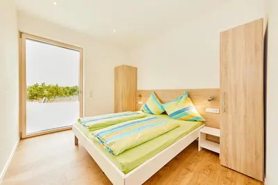 Ein Bett oder Betten in einem Zimmer der Unterkunft Wein-Quartier Leo Pazen