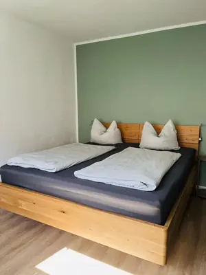 Ein Bett oder Betten in einem Zimmer der Unterkunft Ferienwohnung Weins