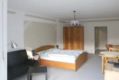 Ein Bett oder Betten in einem Zimmer der Unterkunft Pension Garni Haus Bismarckhöhe