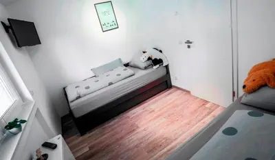 Ein Bett oder Betten in einem Zimmer der Unterkunft Feriendomizil Haus am See