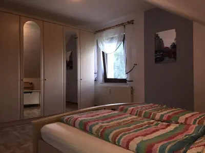 Ein Bett oder Betten in einem Zimmer der Unterkunft Ferienwohnung- Freuen