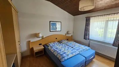 Ein Bett oder Betten in einem Zimmer der Unterkunft Landhaus Wald und See 1