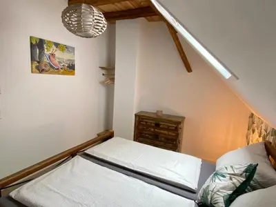 Ein Bett oder Betten in einem Zimmer der Unterkunft Gästehaus Rheinromantik