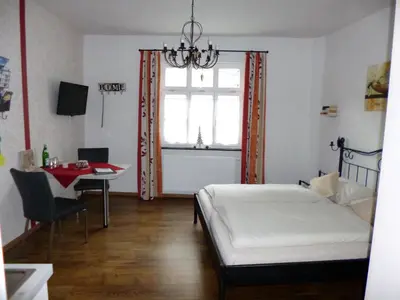 Ein Bett oder Betten in einem Zimmer der Unterkunft Gästehaus Rheinromantik